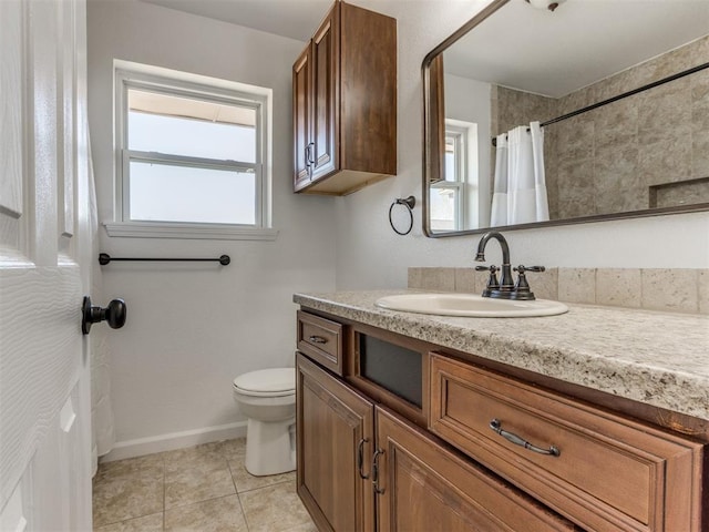 bathroom with toilet, vanity, tile patterned flooring, and curtained shower