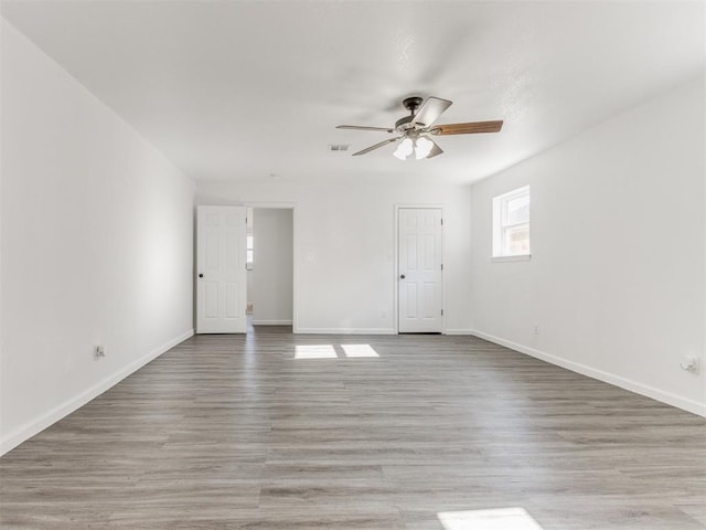 unfurnished room featuring ceiling fan and light hardwood / wood-style flooring