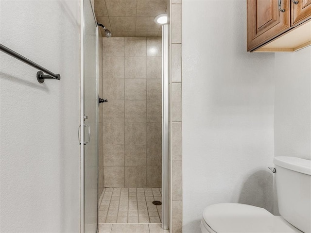 bathroom with toilet and walk in shower