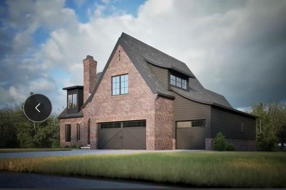 view of front facade featuring a garage and a front yard