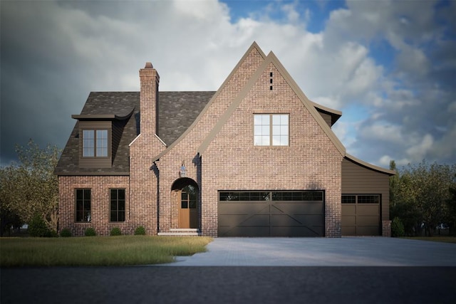 tudor-style house with a garage