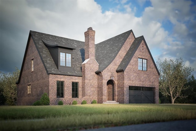 view of front of property with a front lawn and a garage