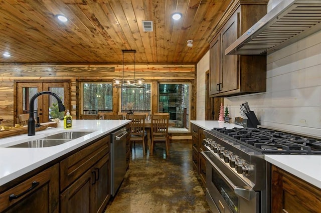 kitchen featuring sink, pendant lighting, stainless steel appliances, wall chimney exhaust hood, and wooden ceiling