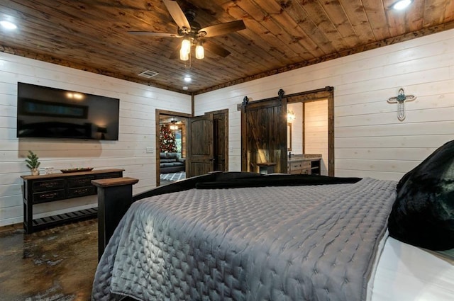 bedroom with ceiling fan, wood ceiling, and a barn door