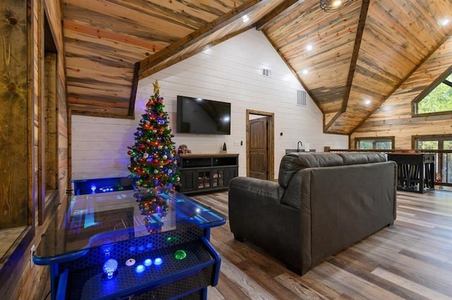 living room featuring hardwood / wood-style floors, lofted ceiling with beams, and wood ceiling