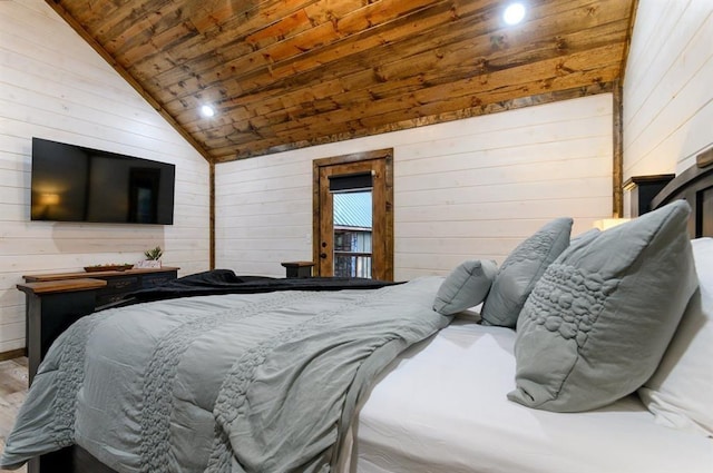 bedroom with wood ceiling, wood walls, and vaulted ceiling