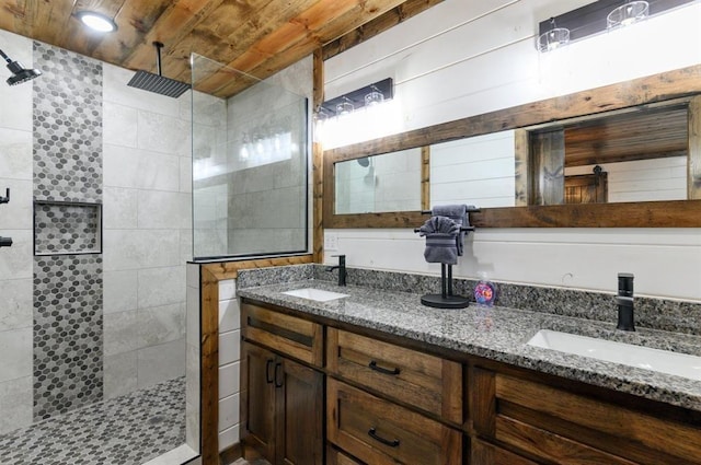 bathroom featuring vanity, tiled shower, and wooden ceiling