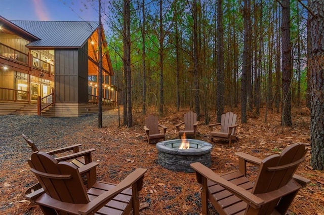 exterior space featuring an outdoor fire pit