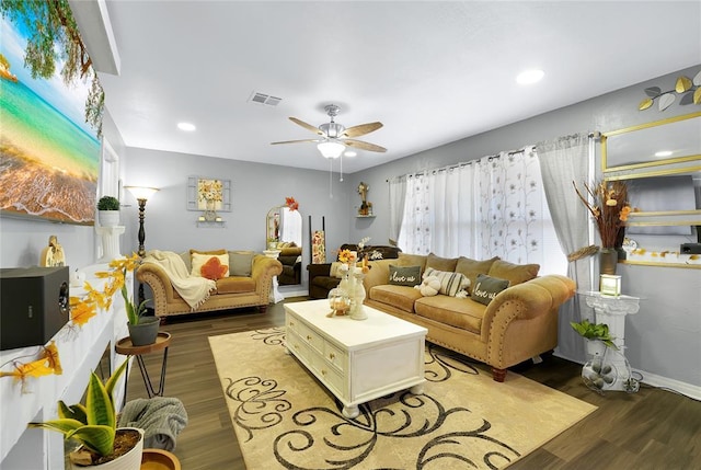 living room with ceiling fan and dark hardwood / wood-style floors