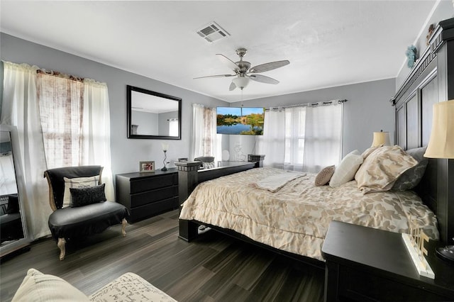 bedroom with ceiling fan and dark hardwood / wood-style flooring