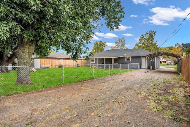 exterior space featuring a yard and a carport