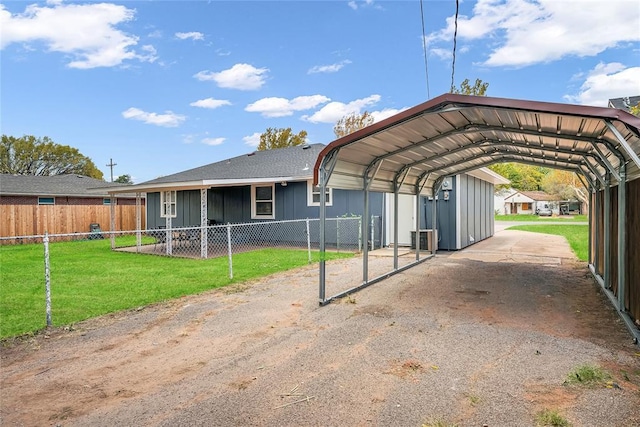 view of vehicle parking with a carport and a lawn