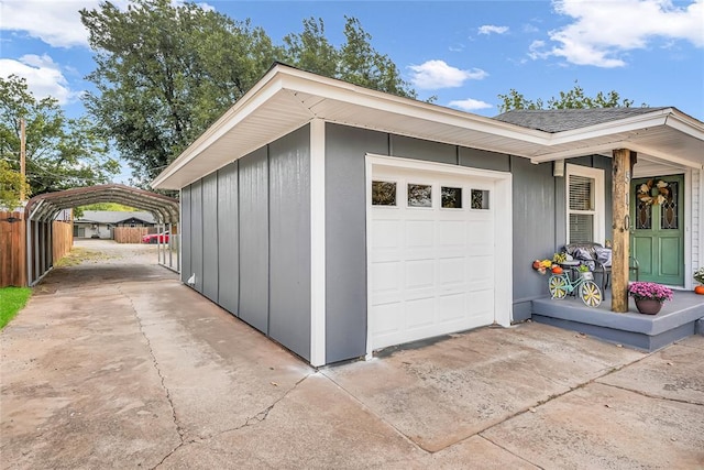 garage featuring a carport