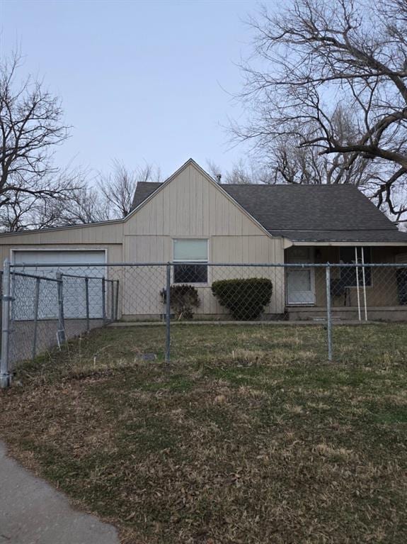 view of home's exterior with a garage and a lawn