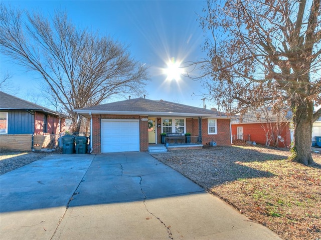 ranch-style house with covered porch and a garage