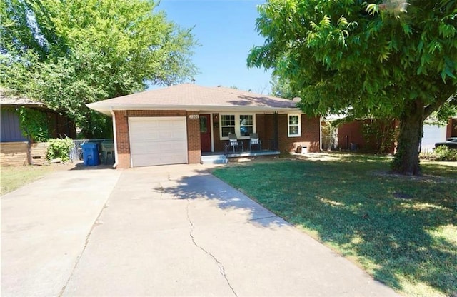 single story home featuring a garage and a front lawn