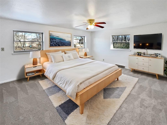 bedroom featuring ceiling fan and light colored carpet