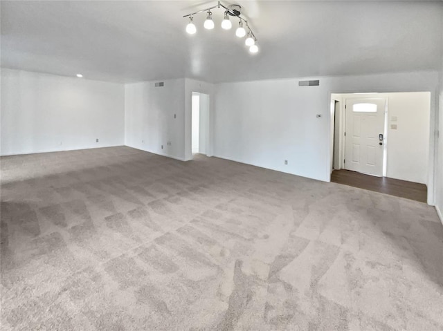 unfurnished living room with carpet