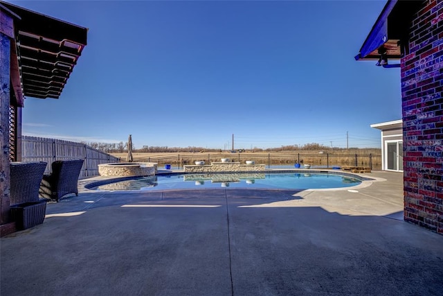 view of pool featuring an in ground hot tub and a patio