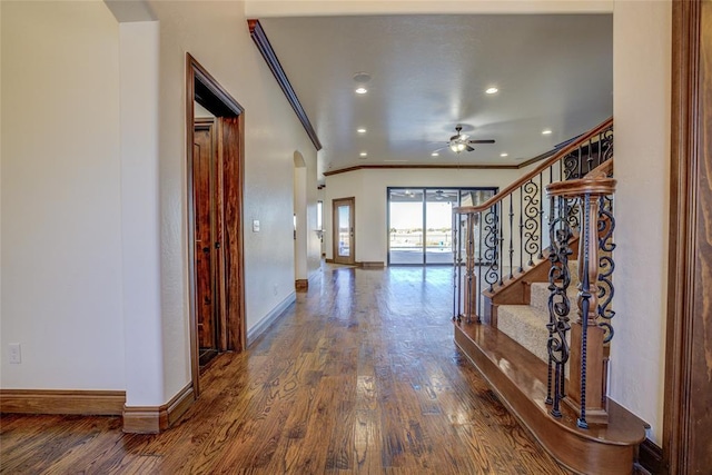 hallway featuring dark hardwood / wood-style flooring and ornamental molding