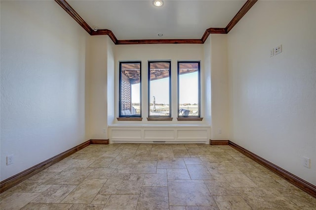 spare room with ornamental molding