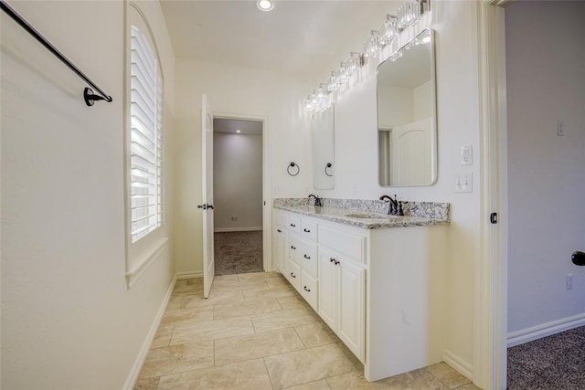 bathroom featuring vanity and tile patterned flooring