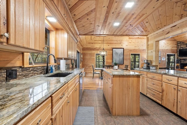 kitchen featuring light stone countertops, wooden ceiling, decorative light fixtures, and a kitchen island