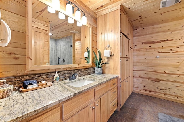 bathroom with vanity, wooden walls, and wooden ceiling