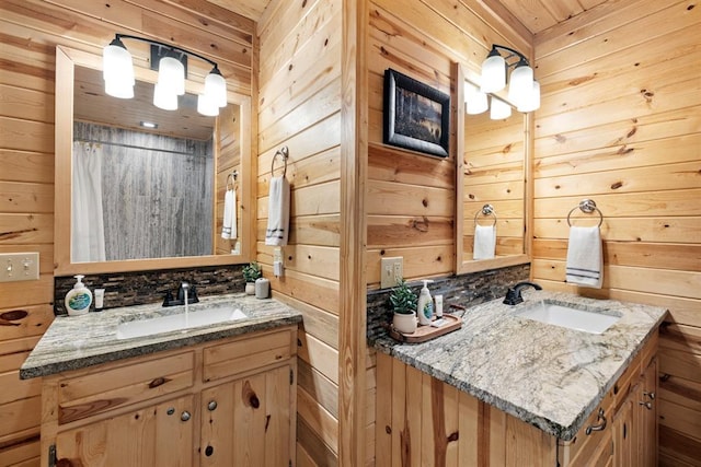 bathroom with vanity and wood walls