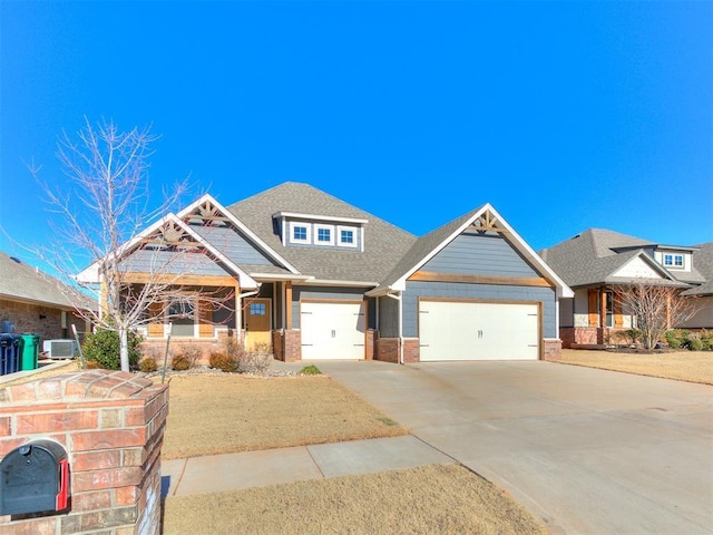 craftsman-style house with a garage and cooling unit