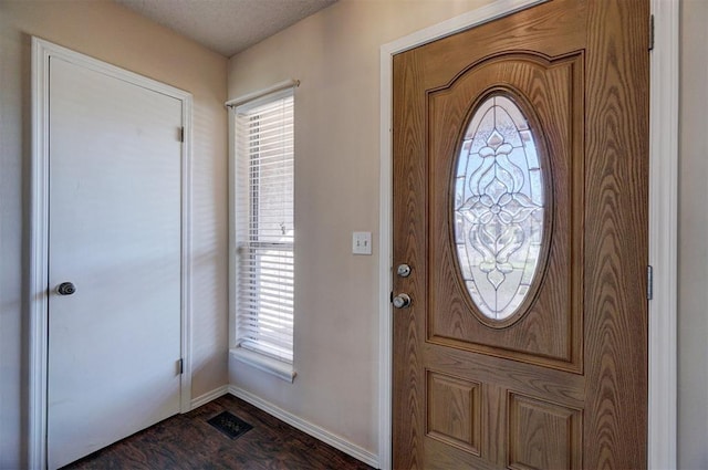 foyer featuring dark wood-type flooring