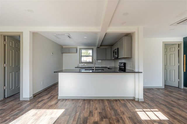 kitchen featuring gray cabinetry, sink, dark wood-type flooring, black / electric stove, and beamed ceiling