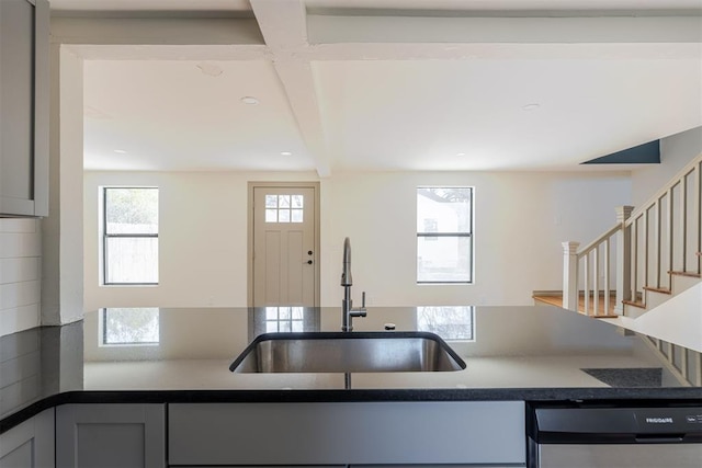 kitchen featuring dishwasher, sink, and gray cabinets