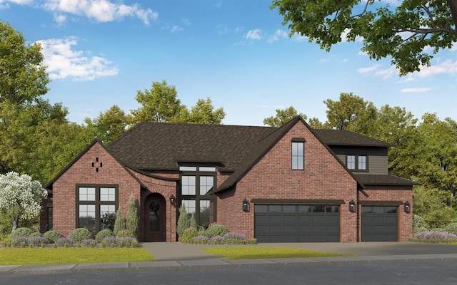 tudor house with a garage, brick siding, and roof with shingles