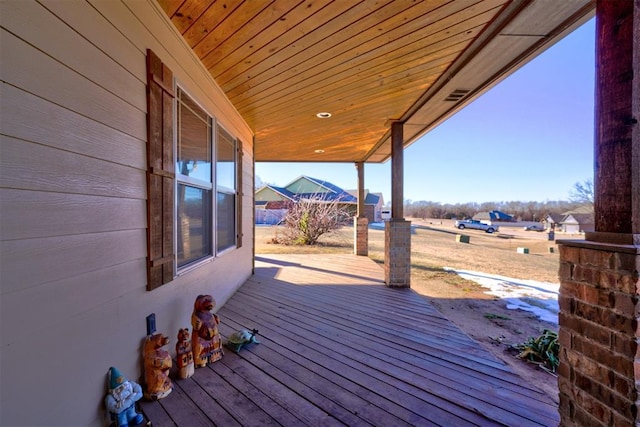 wooden terrace with a porch