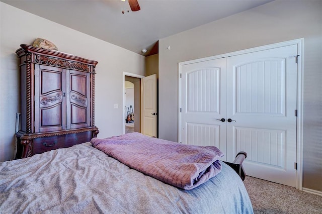 bedroom with a closet, carpet, and ceiling fan