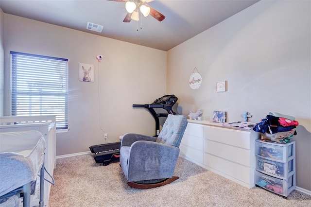 bedroom with ceiling fan and light carpet