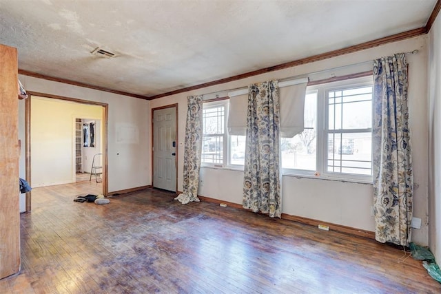 entryway with crown molding and hardwood / wood-style flooring