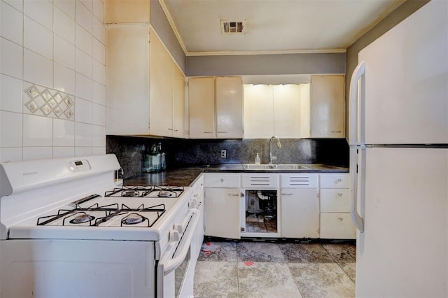 kitchen with tasteful backsplash, sink, white appliances, and ornamental molding