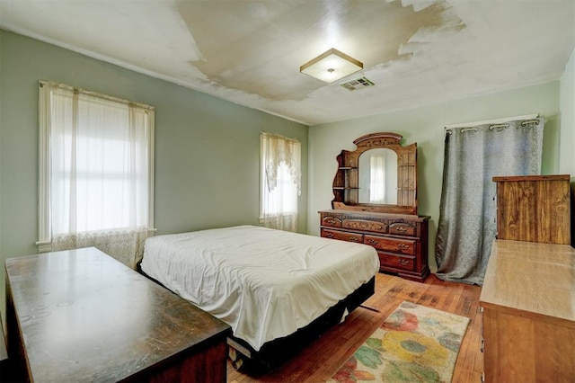 bedroom with light hardwood / wood-style flooring