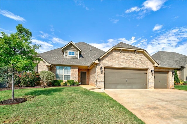 view of front of property with a front lawn and a garage