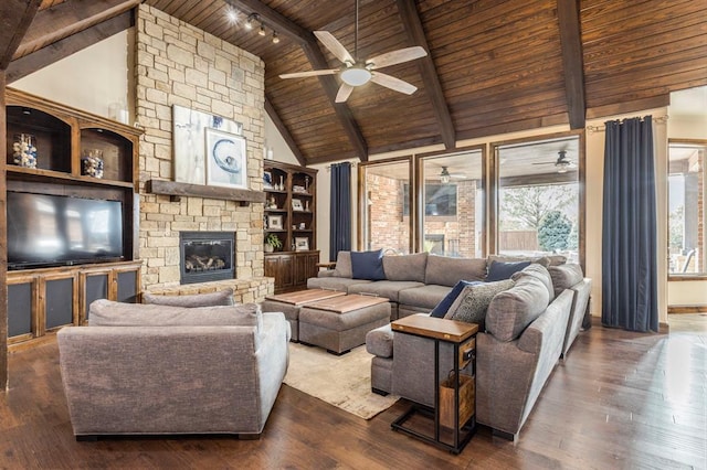 living room with dark wood-type flooring, beam ceiling, and wooden ceiling