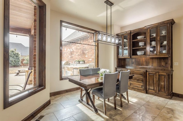 dining room featuring baseboards