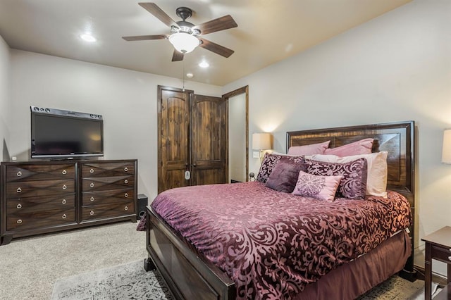 bedroom with ceiling fan and carpet flooring