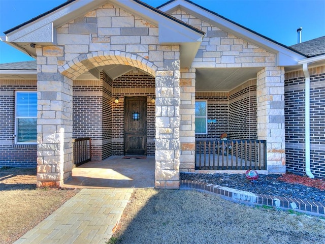 doorway to property featuring a porch