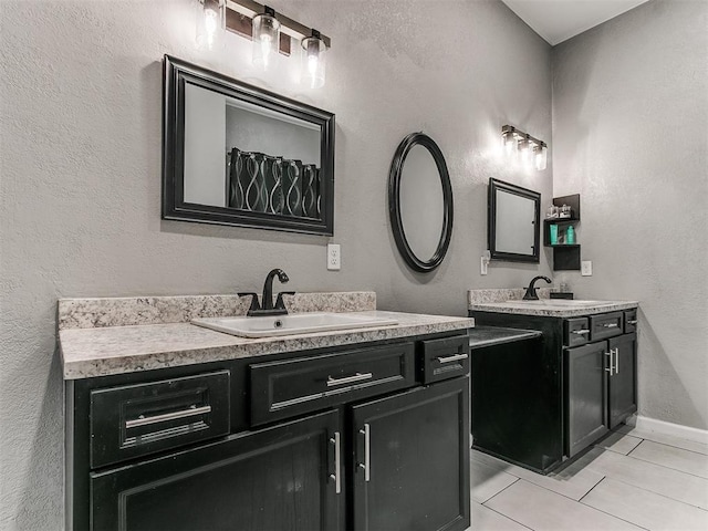 bathroom with tile patterned floors and vanity