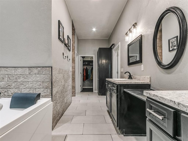 kitchen featuring sink and light tile patterned flooring