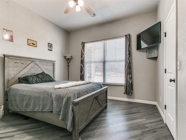 bedroom featuring dark wood-type flooring and ceiling fan