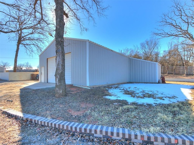 view of home's exterior with an outbuilding and a garage