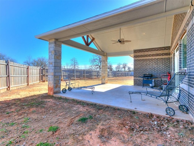 view of patio featuring ceiling fan